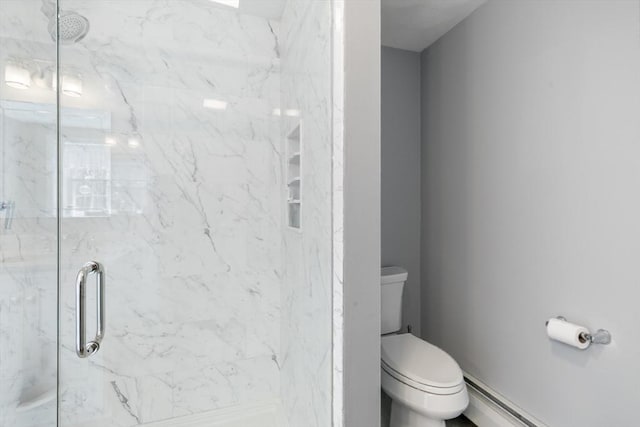 full bath featuring toilet, a baseboard heating unit, and a marble finish shower