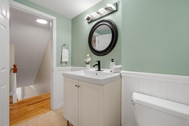 bathroom with vanity, tile patterned floors, and toilet