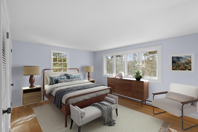 bedroom with wood finished floors