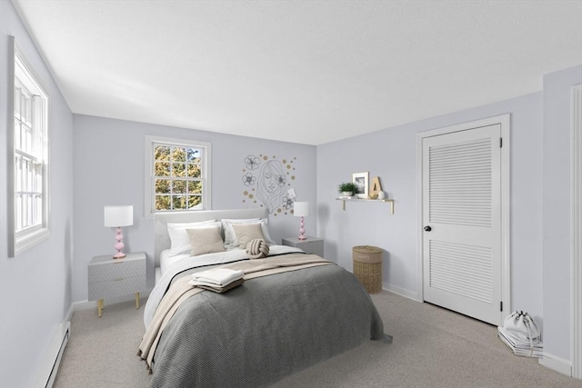 carpeted bedroom with baseboards and baseboard heating