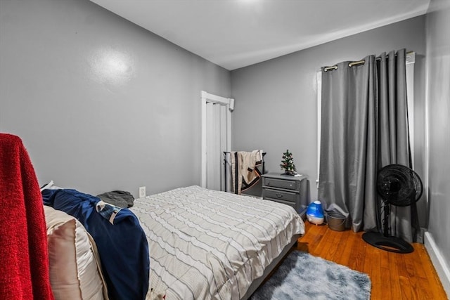 bedroom with hardwood / wood-style floors