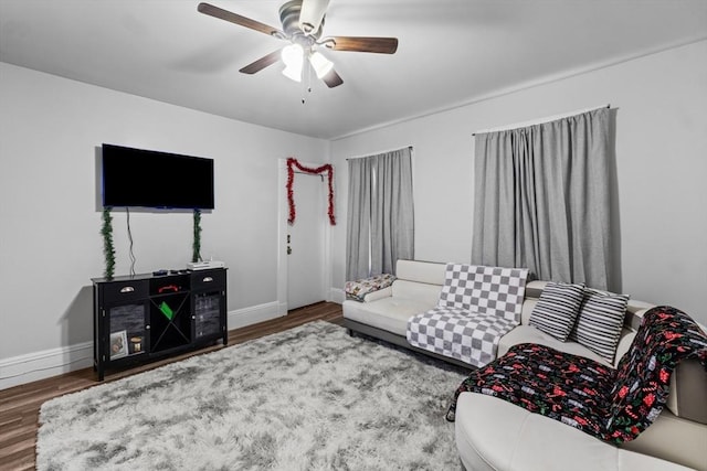 living room with ceiling fan and hardwood / wood-style floors