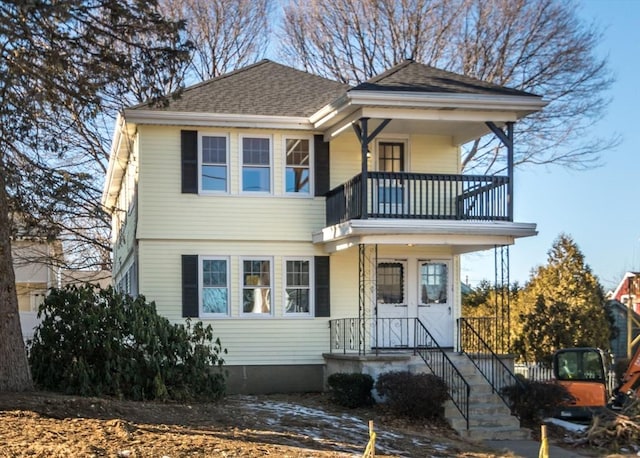 view of front of home with a balcony