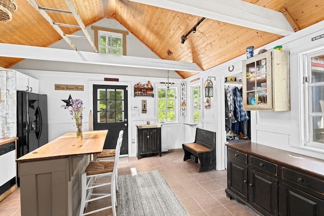 18 Russell Holmes Way, Carver, MA 02330 - kitchen featuring wooden ceiling, black refrigerator with ice dispenser, light tile patterned floors, wood counters, and plenty of natural light