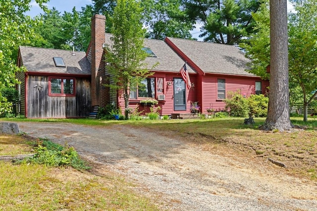 18 Russell Holmes Way, Carver, MA 02330 - view of front of home featuring a chimney, roof with shingles, dirt driveway, and cooling unit