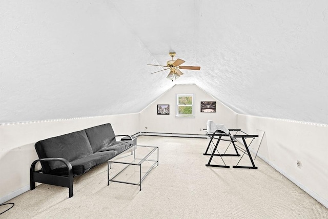 18 Russell Holmes Way, Carver, MA 02330 - living area featuring vaulted ceiling, a ceiling fan, carpet, baseboard heating, and a textured ceiling