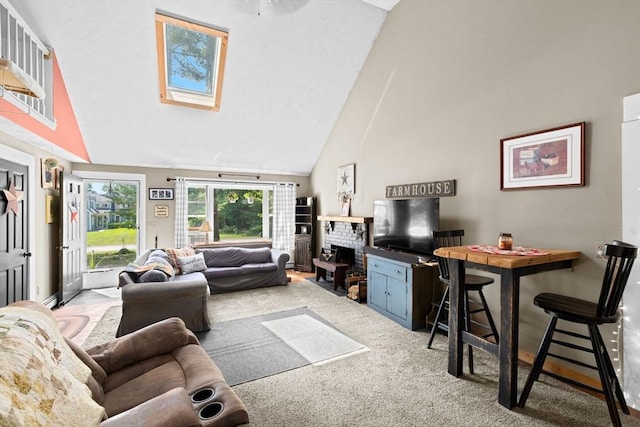 18 Russell Holmes Way, Carver, MA 02330 - living room with high vaulted ceiling, a skylight, carpet flooring, and a fireplace