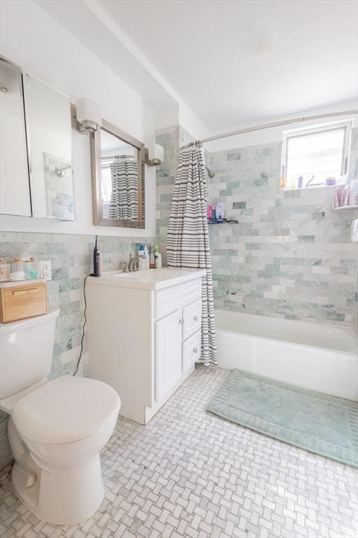 28 Edison Grn Unit 2, Boston, MA 02125 - full bathroom with vanity, shower / tub combo, and tile walls