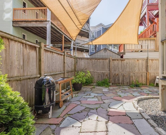 28 Edison Grn Unit 2, Boston, MA 02125 - fenced backyard featuring a patio area