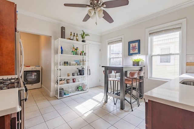 28 Edison Grn Unit 2, Boston, MA 02125 - dining area featuring washer / clothes dryer, crown molding, light tile patterned floors, and ceiling fan