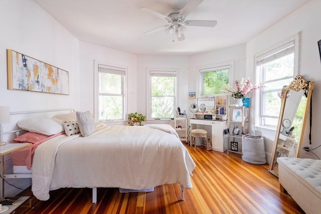 28 Edison Grn Unit 2, Boston, MA 02125 - bedroom with multiple windows, light wood-type flooring, and a ceiling fan