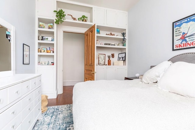bedroom featuring wood finished floors