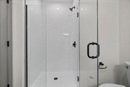 203 Lowell St Unit 204, Wilmington, MA 01887 - full bathroom with a stall shower and toilet