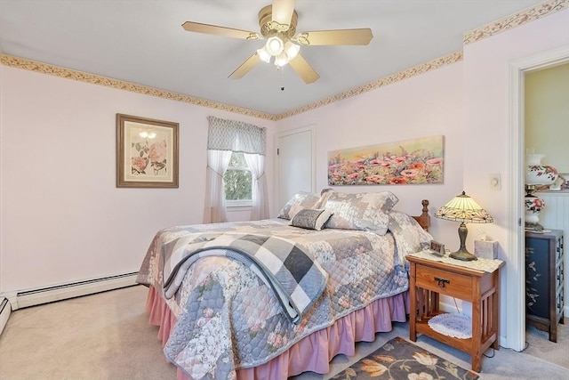 bedroom featuring a baseboard heating unit, carpet floors, and ceiling fan