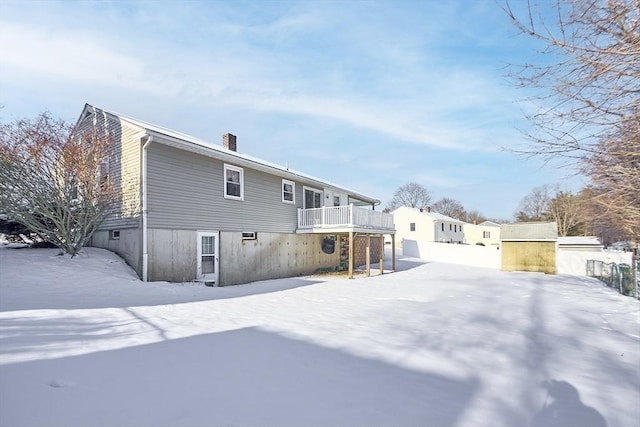 snow covered house with a balcony