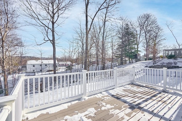 view of snow covered deck