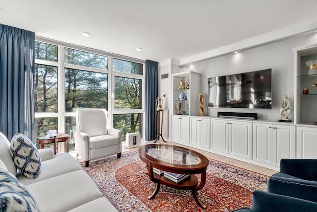 living room with expansive windows and hardwood / wood-style flooring