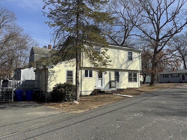 colonial-style house with a chimney