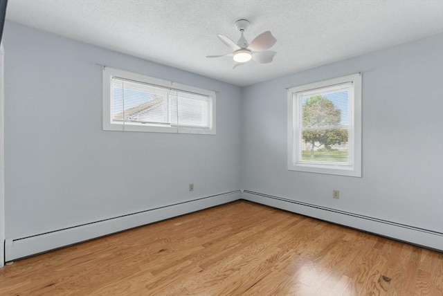 1064 James St Unit 1064, Chicopee, MA 01022 - empty room featuring light wood finished floors, a baseboard radiator, a textured ceiling, and a ceiling fan