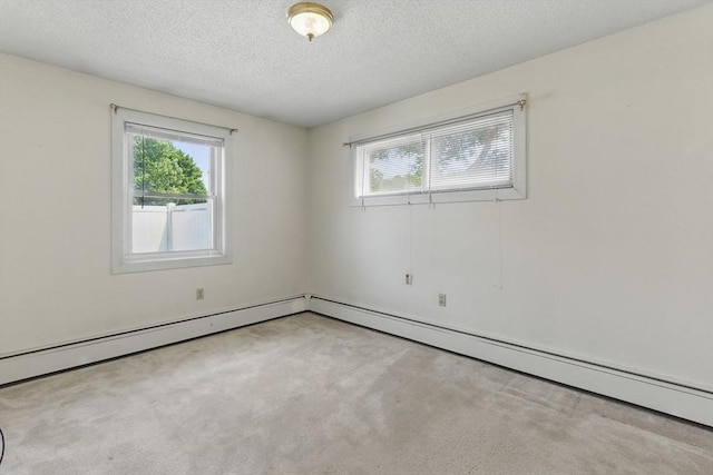 1064 James St Unit 1064, Chicopee, MA 01022 - carpeted spare room featuring plenty of natural light, a textured ceiling, and a baseboard radiator