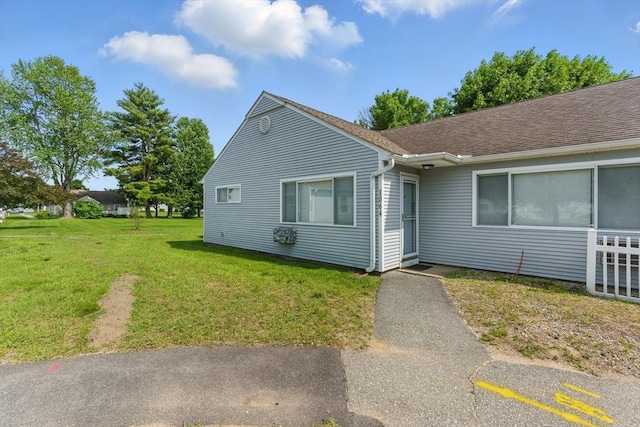 1064 James St Unit 1064, Chicopee, MA 01022 - view of front of home featuring a front yard and roof with shingles