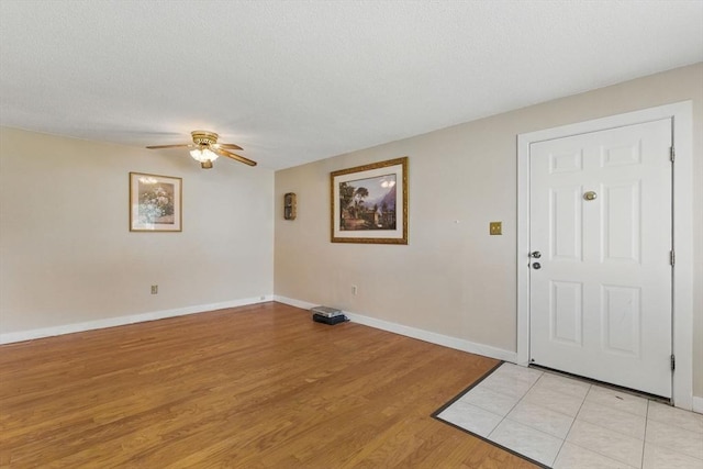 1064 James St Unit 1064, Chicopee, MA 01022 - foyer entrance featuring ceiling fan, light wood-style flooring, baseboards, and a textured ceiling