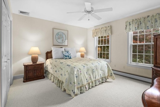 54 Wagon Rd, Walpole, MA 02081 - carpeted bedroom with a baseboard radiator, multiple windows, a closet, and a ceiling fan