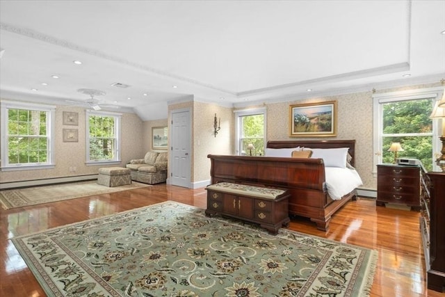 54 Wagon Rd, Walpole, MA 02081 - bedroom with baseboard heating, wood finished floors, multiple windows, wallpapered walls, and crown molding