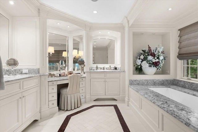 54 Wagon Rd, Walpole, MA 02081 - bathroom featuring two vanities, a garden tub, inlaid floor details, recessed lighting, and crown molding