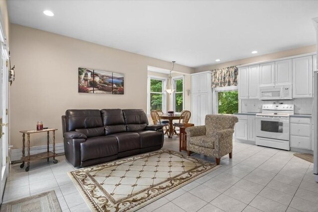54 Wagon Rd, Walpole, MA 02081 - living area with light tile patterned floors and recessed lighting