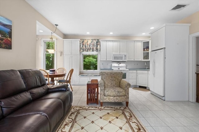 54 Wagon Rd, Walpole, MA 02081 - living area with recessed lighting and light tile patterned flooring