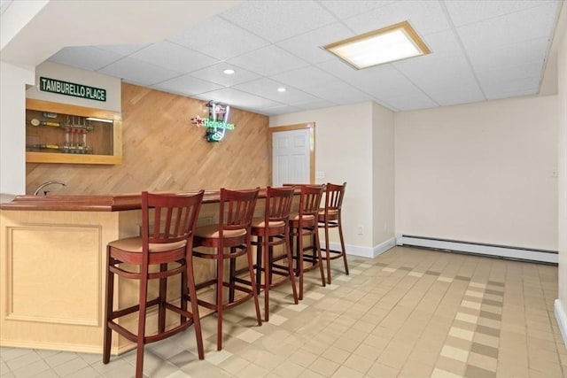 54 Wagon Rd, Walpole, MA 02081 - indoor dry bar with a baseboard heating unit, wood walls, a drop ceiling, and recessed lighting