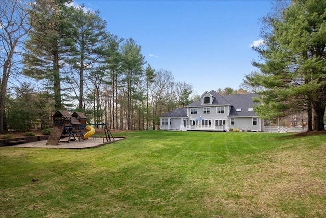 54 Wagon Rd, Walpole, MA 02081 - view of grassy yard featuring a playground