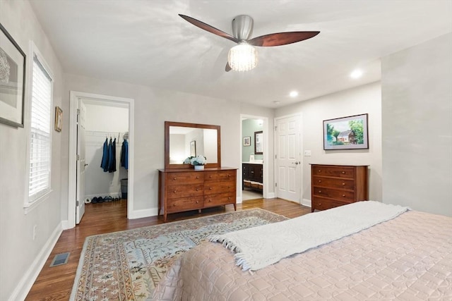 35 Orchard Rd, Milton, MA 02186 - bedroom featuring wood finished floors, a spacious closet, baseboards, a closet, and ensuite bath