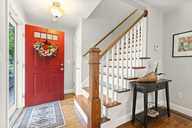35 Orchard Rd, Milton, MA 02186 - entrance foyer with wood finished floors, stairs, and baseboards