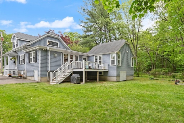 35 Orchard Rd, Milton, MA 02186 - rear view of house with a wooden deck, stairway, and a yard