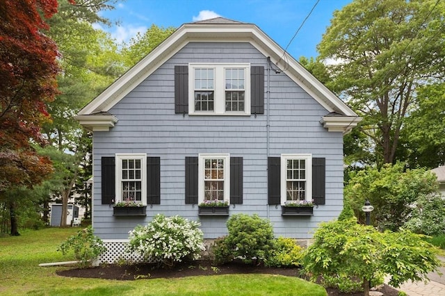 35 Orchard Rd, Milton, MA 02186 - view of side of home with a yard