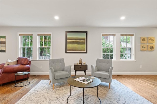 35 Orchard Rd, Milton, MA 02186 - living room with wood finished floors, baseboards, and recessed lighting