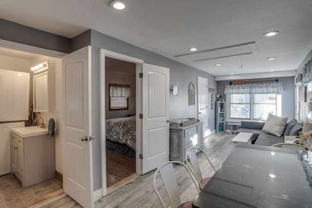 bathroom with hardwood / wood-style floors