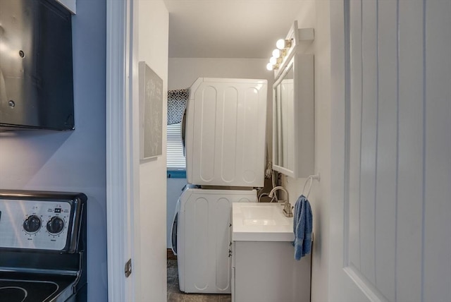 laundry area with sink and stacked washer / dryer