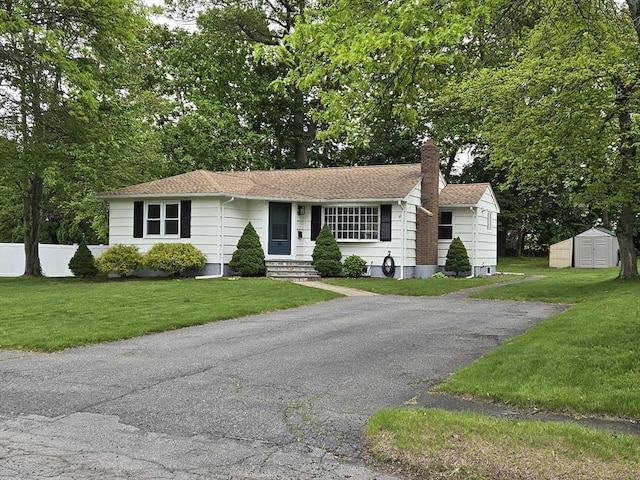 80 Dobbins St, Waltham, MA 02451 - ranch-style house featuring a chimney, a front lawn, entry steps, and roof with shingles