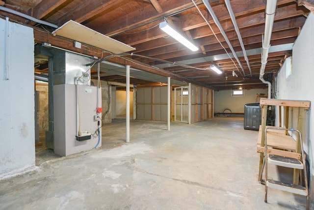 80 Dobbins St, Waltham, MA 02451 - unfinished below grade area with heating unit and washer / clothes dryer