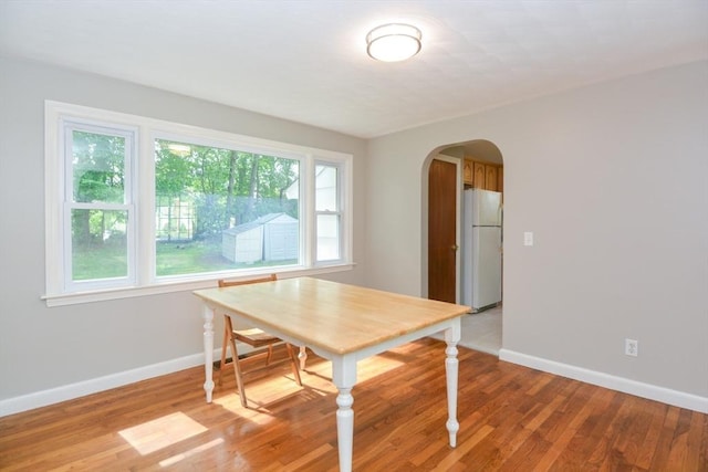 80 Dobbins St, Waltham, MA 02451 - dining space with arched walkways, plenty of natural light, and baseboards