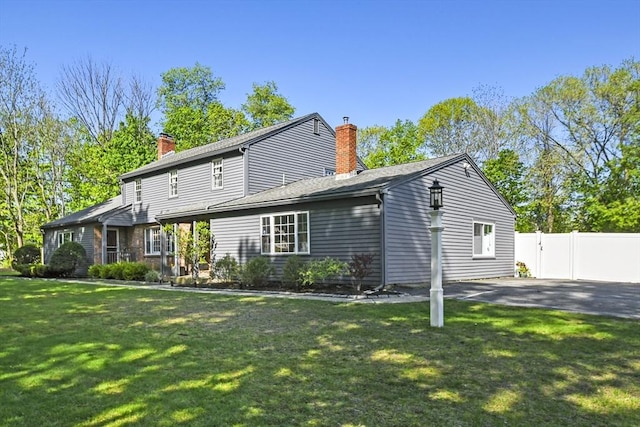 11 Fern Ave, Amesbury, MA 01913 - rear view of house featuring a chimney