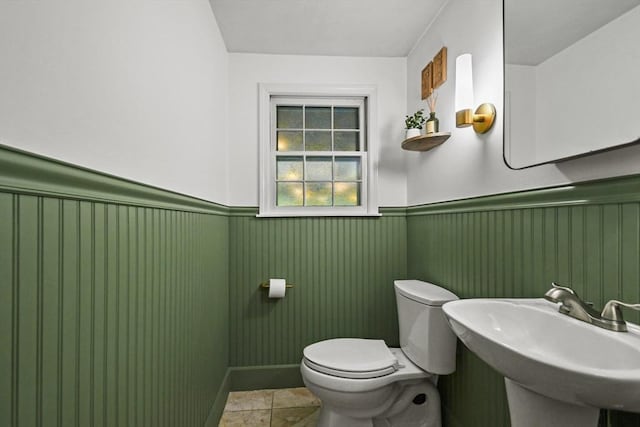 11 Fern Ave, Amesbury, MA 01913 - bathroom with wainscoting, toilet, and a sink