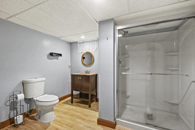 11 Fern Ave, Amesbury, MA 01913 - bathroom with a paneled ceiling, a shower stall, toilet, wood finished floors, and baseboards
