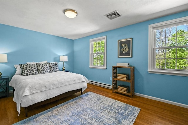 11 Fern Ave, Amesbury, MA 01913 - bedroom featuring a baseboard radiator, wood finished floors, and baseboards