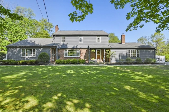 11 Fern Ave, Amesbury, MA 01913 - view of front of house featuring a chimney and a front yard
