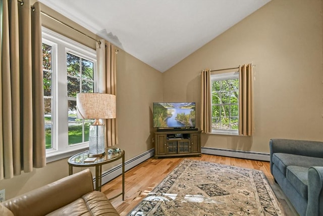 11 Fern Ave, Amesbury, MA 01913 - living room featuring a baseboard radiator, lofted ceiling, and light wood-style flooring