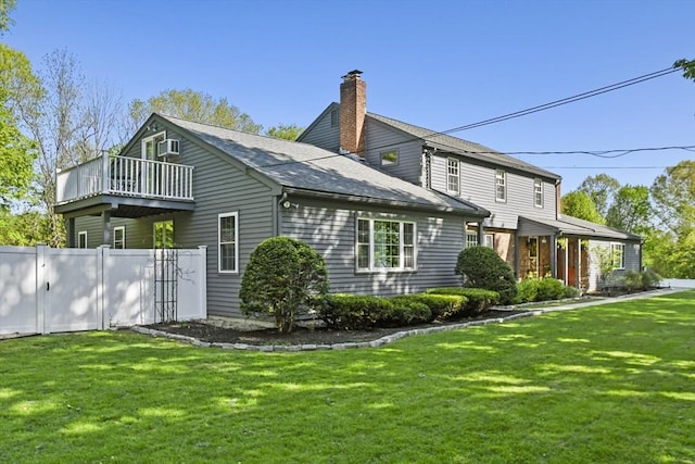 11 Fern Ave, Amesbury, MA 01913 - back of property with a chimney and roof with shingles
